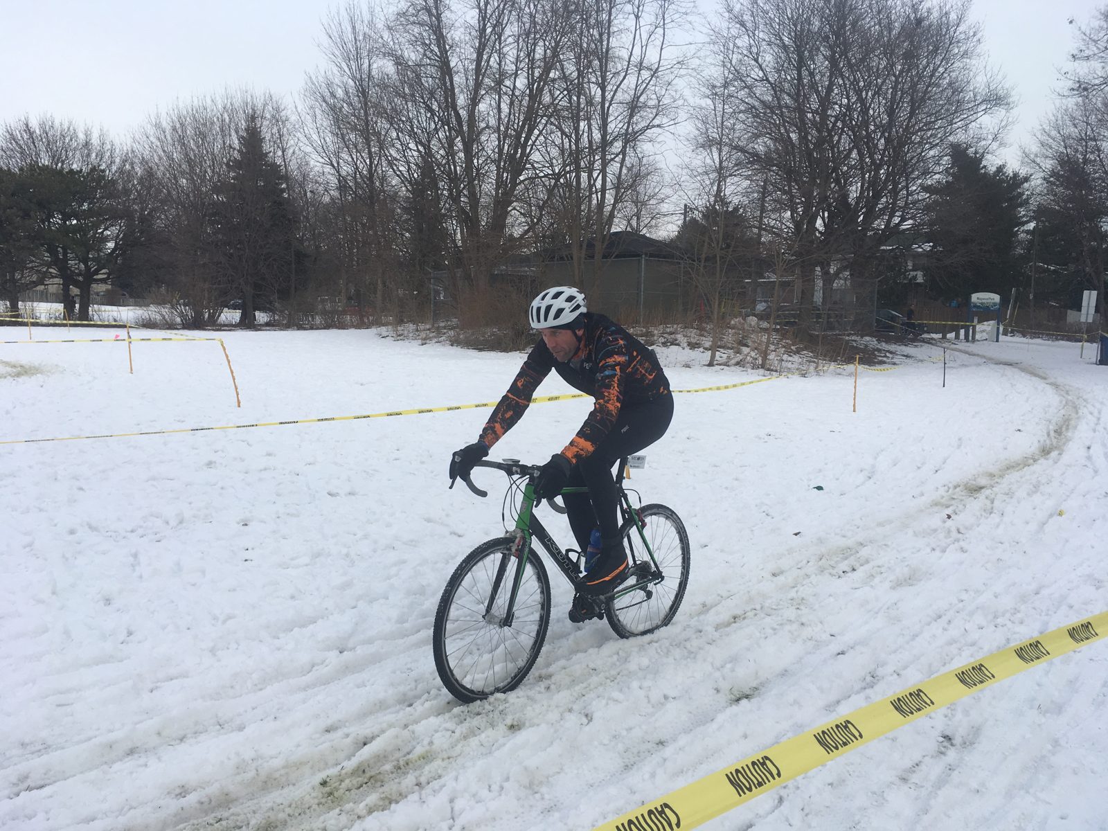 Bike racing in a local park on a snowy winters New Years Eve