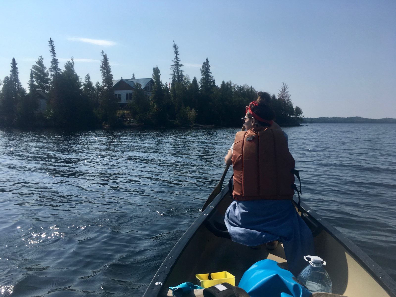 Paddling past lake cottages