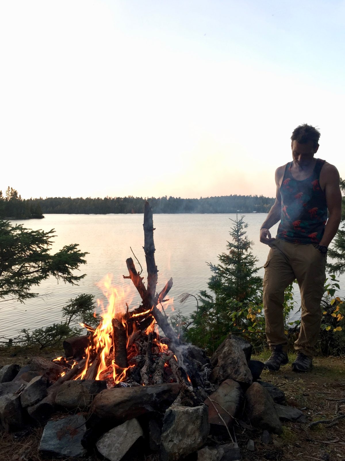 enjoying a campfire by the lake