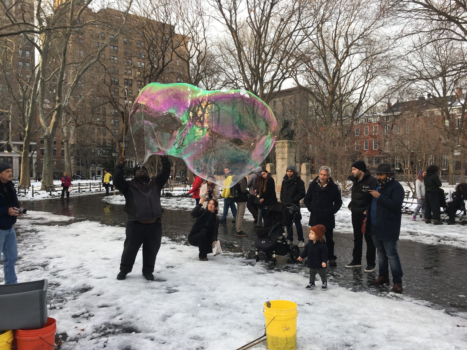 The city is full of surprises - a performer blowing bubbles in Washington Square park