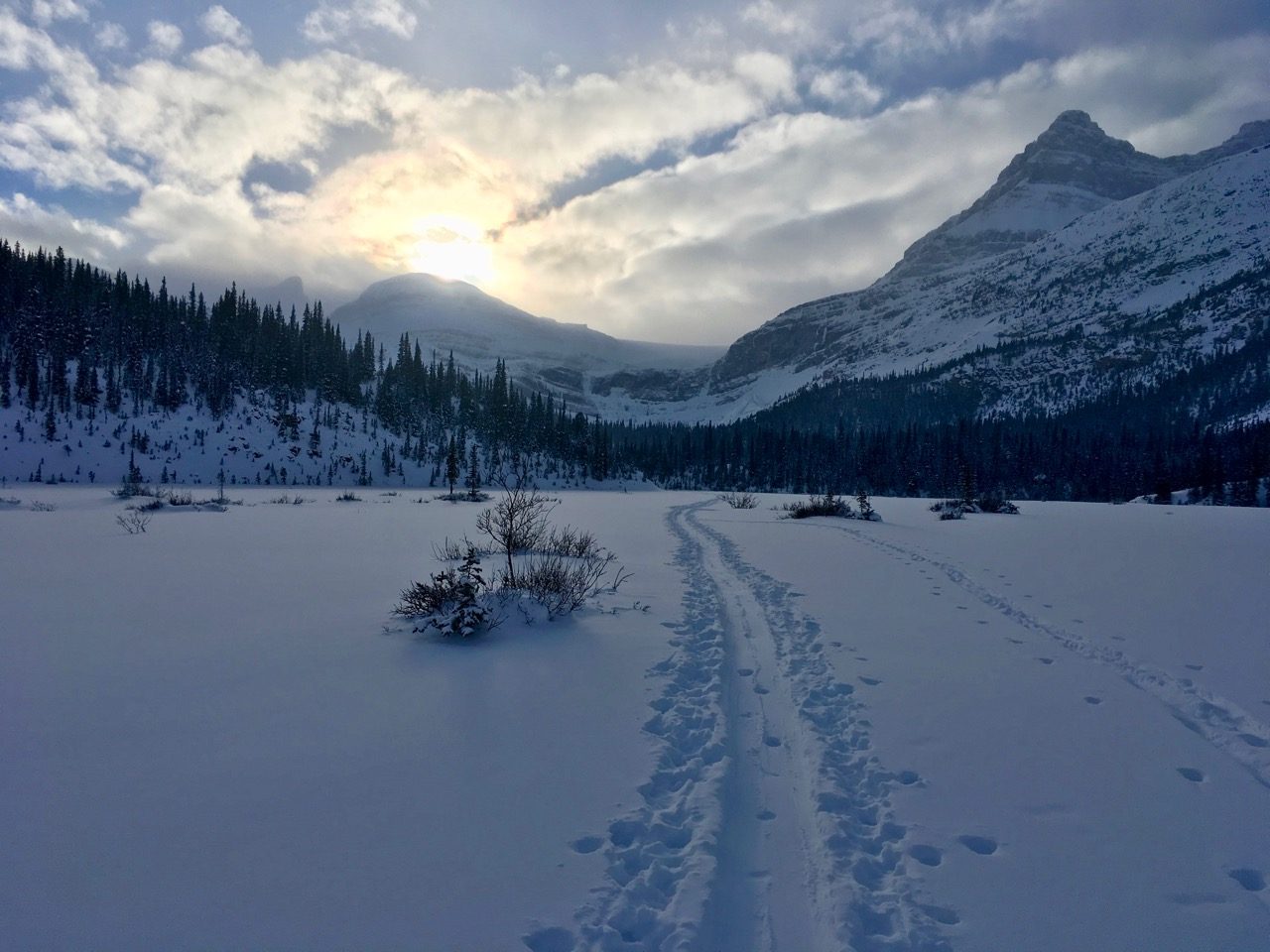 Skiing across Bow Lake to Glacier Falls, Alberta